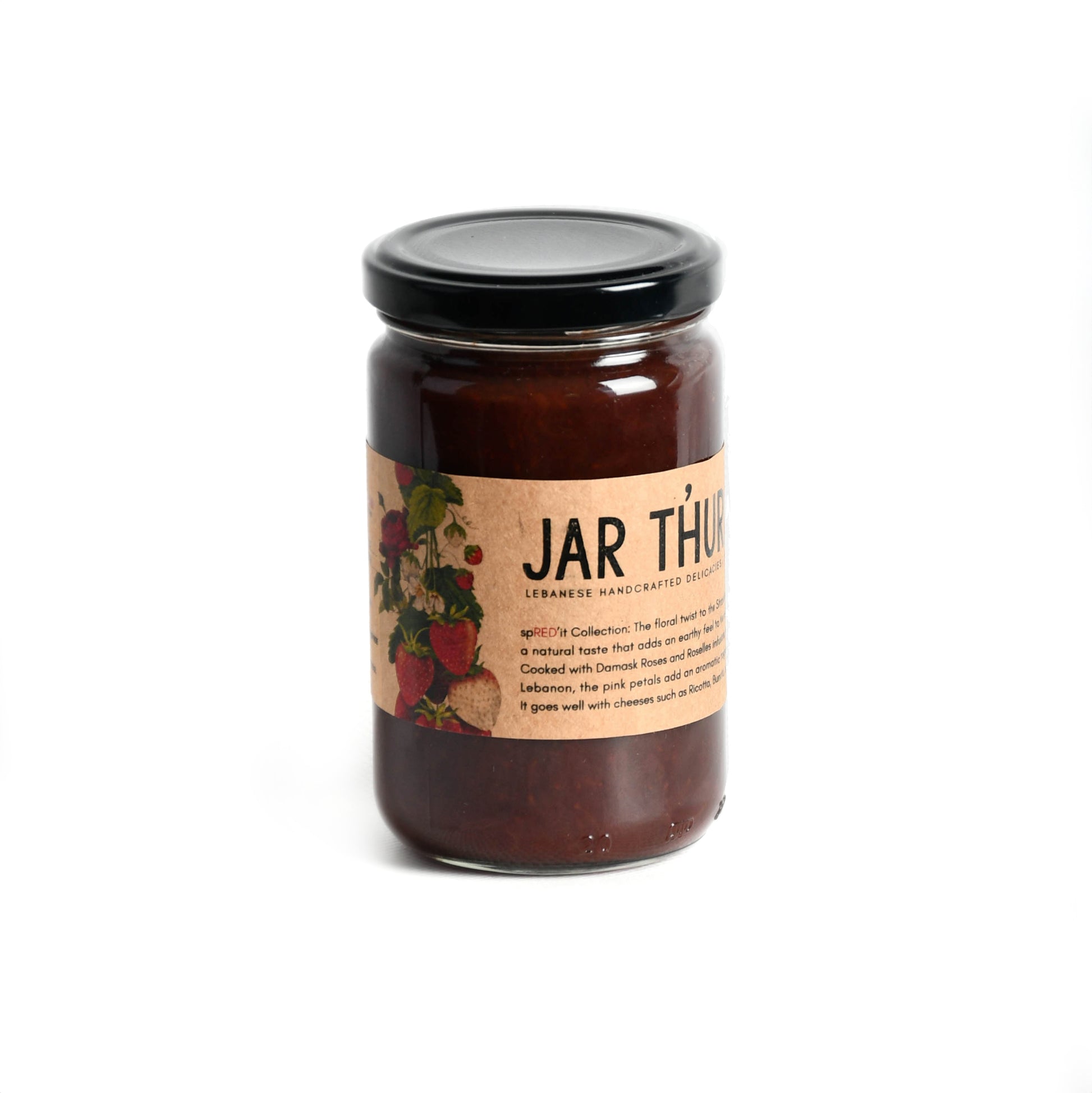 a glass jar of strawberry jam and rose petals