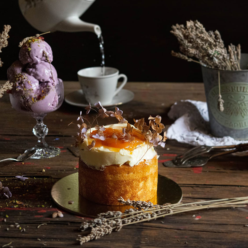Peach and lavender flowers jam on a cake 